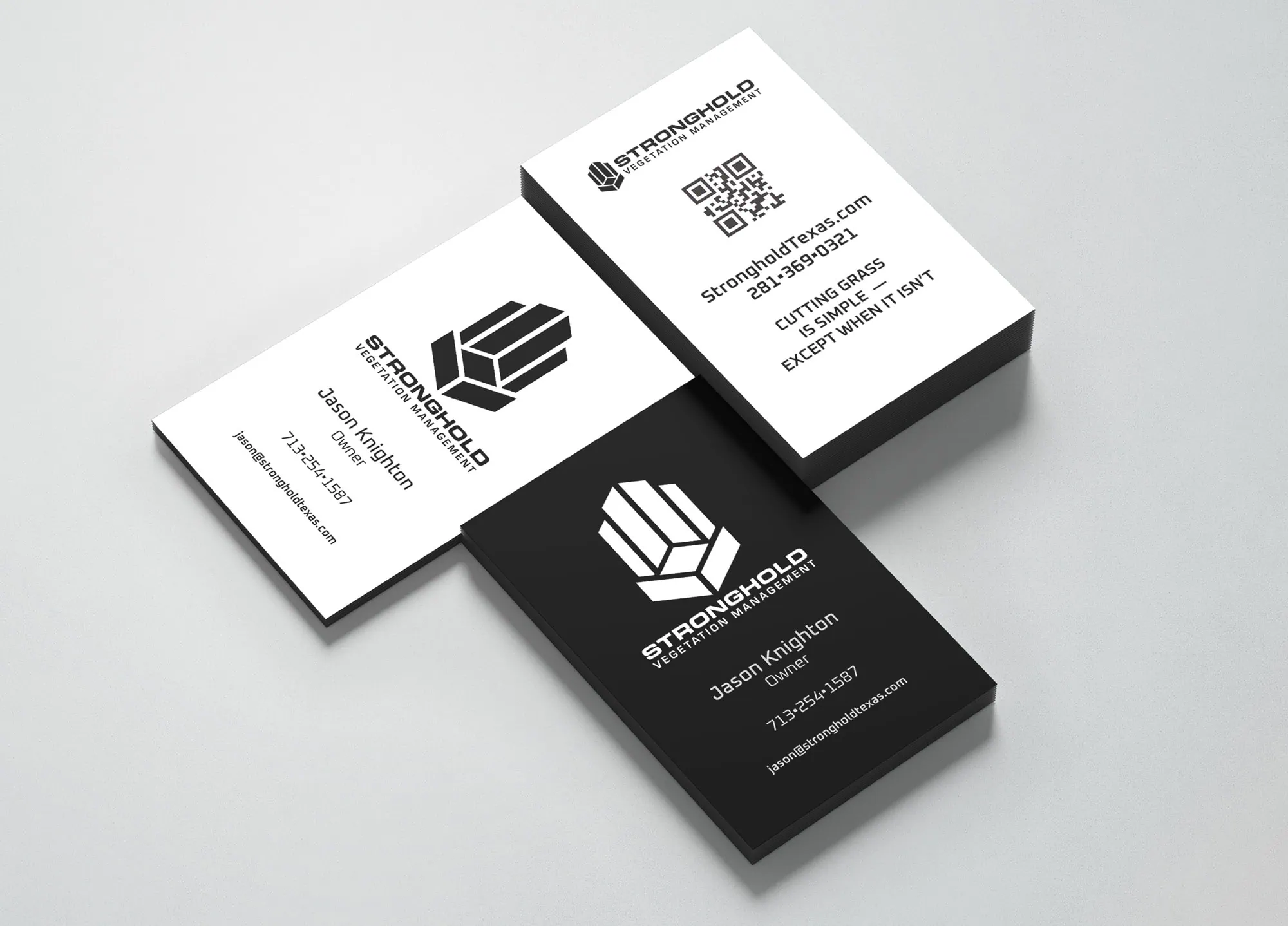 The image shows a collection of business card print for Stronghold Vegetation Management. Two black cards display white text with contact details for Jason Knighton, providing a sense of stark professionalism. Two white cards feature a QR code along with other contact information and the company's logo, which is also on the black cards. - Market Design Team: Define. Structure. Expand.
