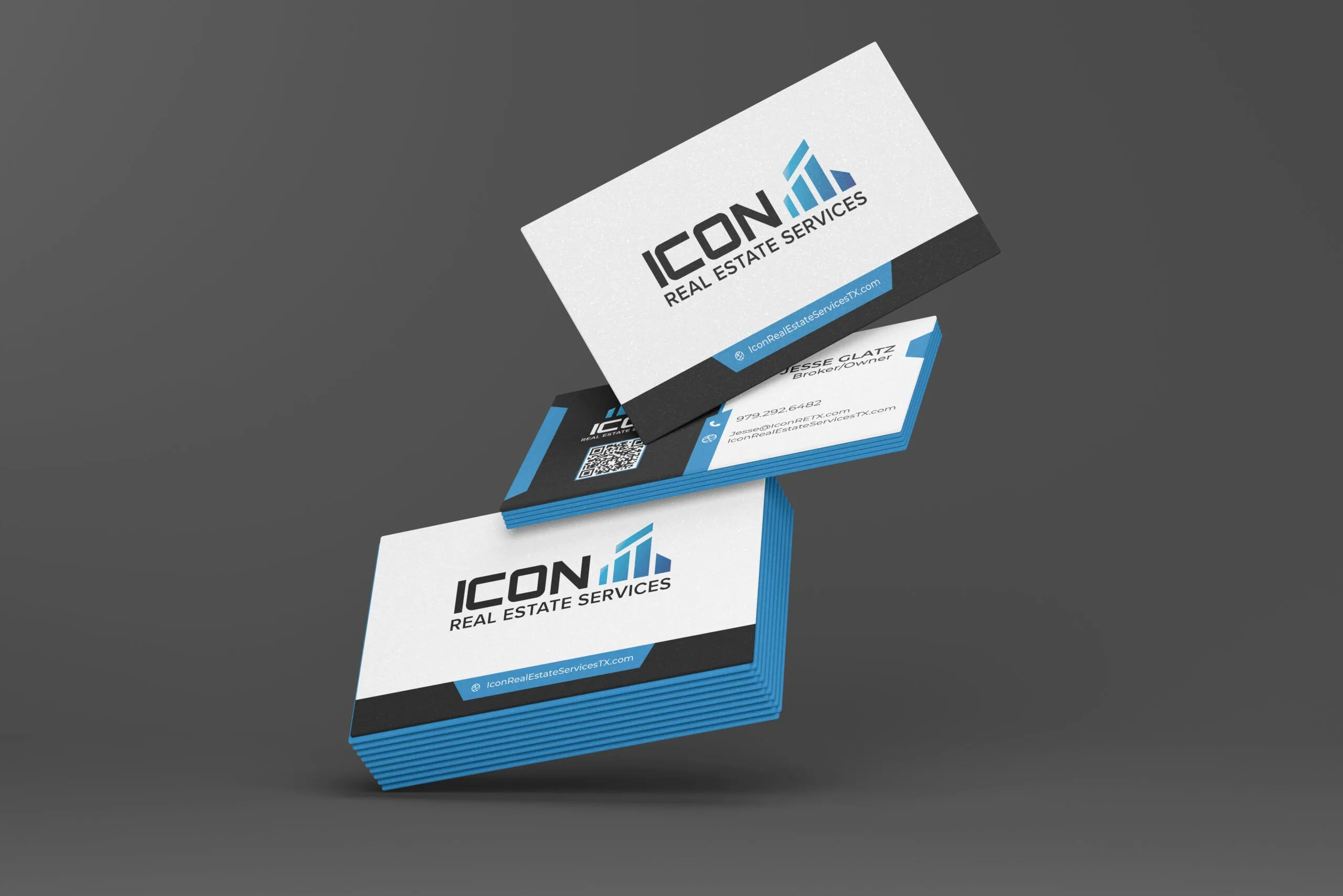 A stack of business cards with “ICON Real Estate Services” logo, blue accent edges, and QR code. Two cards are propped up showing contact information on a dark gray background. - Market Design Team: Define. Structure. Expand.