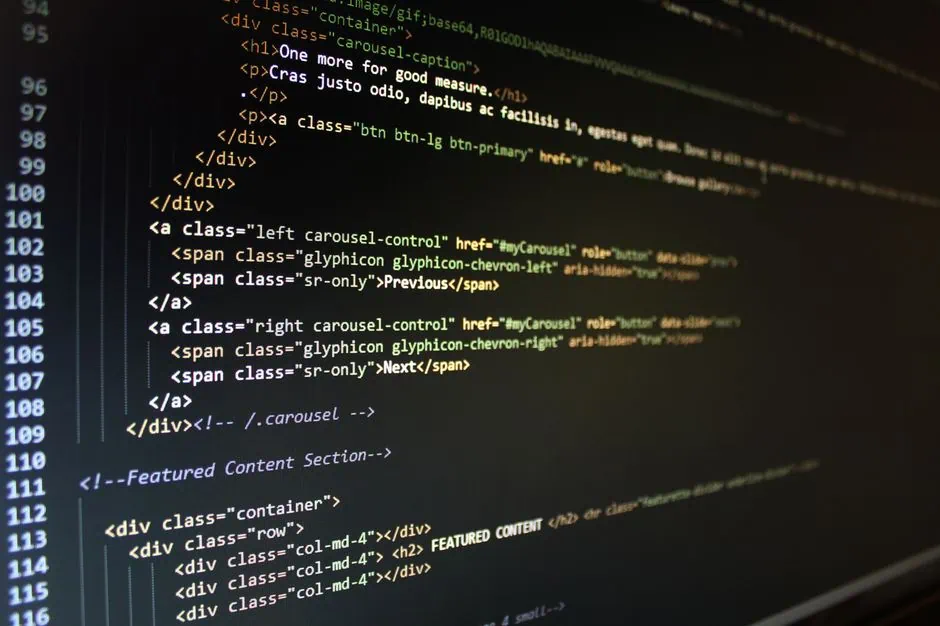 a computer screen displays html code for a carousel component, including div tags, span elements, class attributes, and navigation controls for previous and next slides—an essential feature often utilized in website development services in pearland. market design team: define. structure. expand.